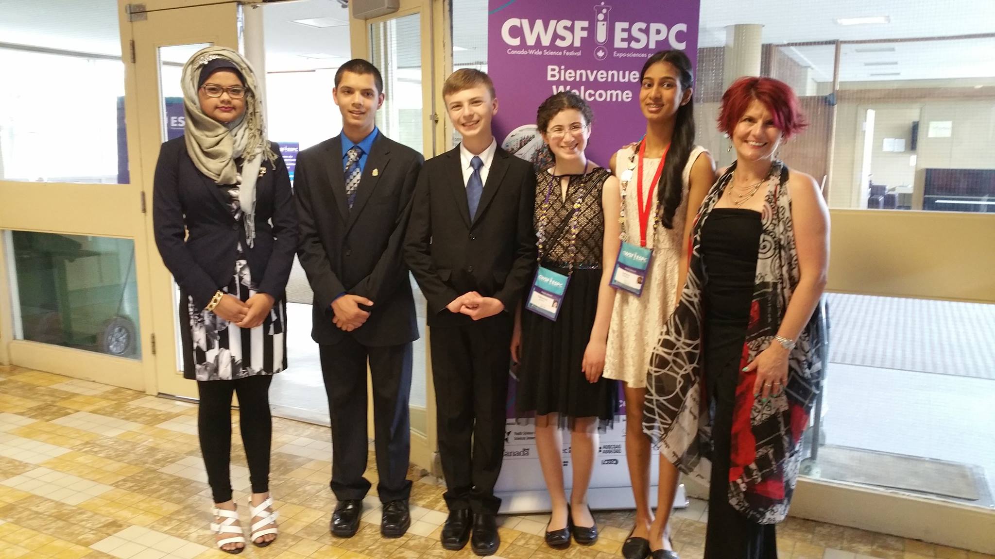 The team at the CWSF welcome banner