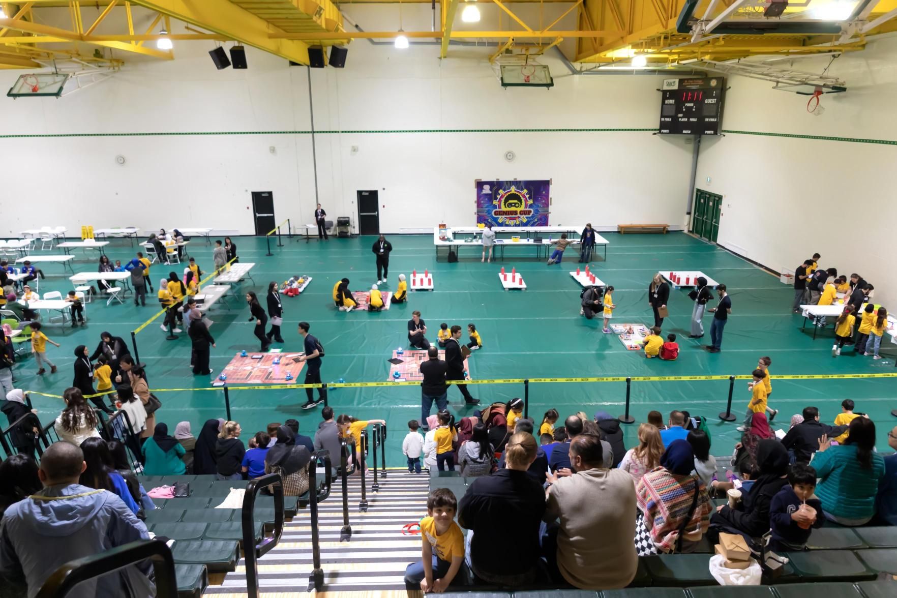 Students working on robotics activities at a community event