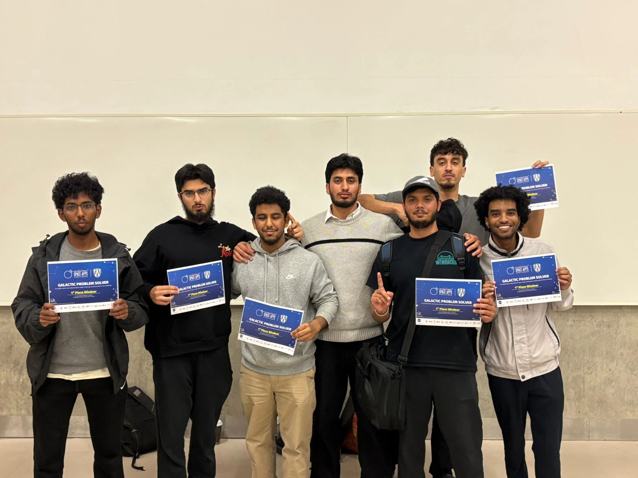 Team holding 1st Place Windsor certificates at the NASA Space Apps Challenge